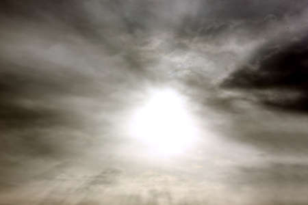 Gray sky. Sunlight. Clouds are floating across the sky. Backgrounds. Space to copy.