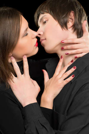 Closeup portrait of a sensual loving couple. Isolated