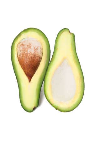 Green avocado with nucleus. Isolated on white