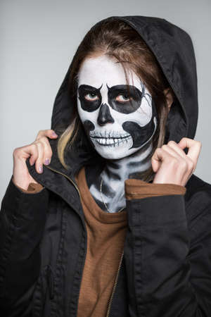 Portrait of young woman with scary makeup for Halloweenの写真素材
