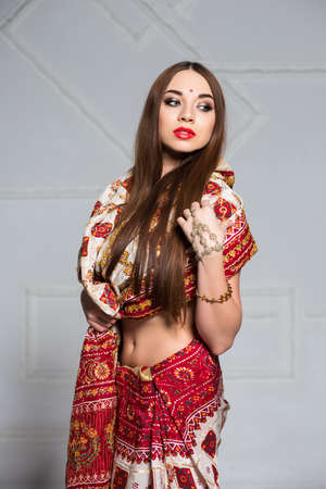 Portrait of thoughtful young woman wearing indian traditional sari costumeの写真素材