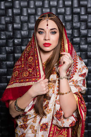 Portrait of nice Indian woman wearing traditional sari costumeの写真素材