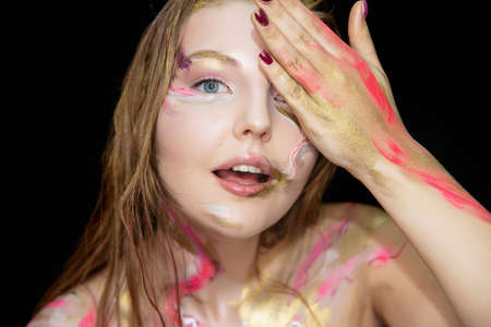 Portrait of a adorable young woman with creative make up on her face