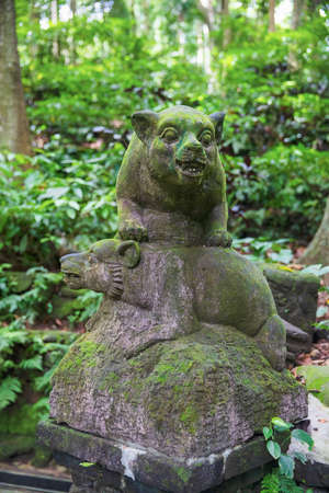 Traditional Balinese statue of two bears. Ubud, Bali island, Indonesiaの写真素材