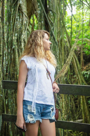 Portrait of a beautiful young woman. Monkey forest, Bali Island, Indonesiaの写真素材