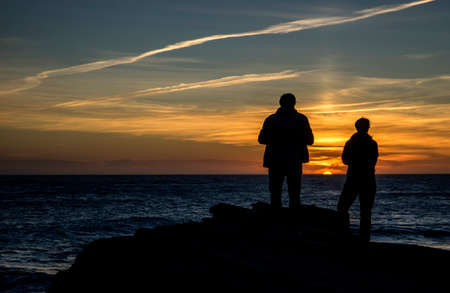 couple on the coast of Tarifa at sunset, Spainの写真素材