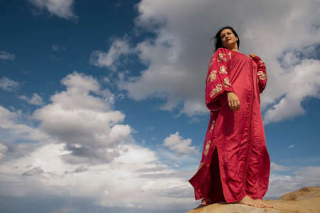 Pretty Woman on a rock and relaxed