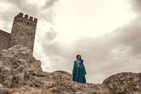 Wife of a medieval past near the castleの写真素材
