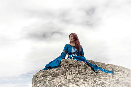 another beautiful woman on a little rockの写真素材