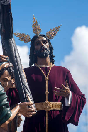 With the cross Jesus on the shoulder, brotherhoods of penance of Holy Week in Seville, Peaceの写真素材