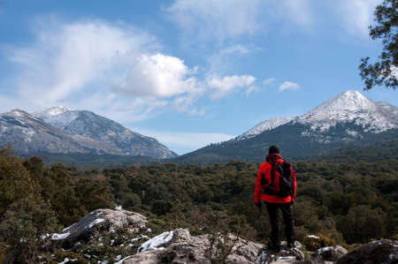 Man who practice the sport of hiking in the mountains