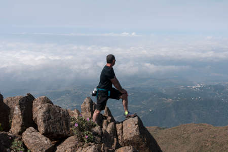 Man who practice the sport of hiking in the mountainsの写真素材