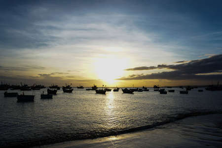 Boats and sunset sky reflections view from vietnamの写真素材
