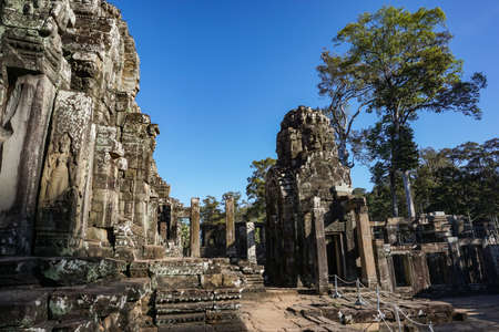 The stone of Bayon belong angkor thom nearly angkor wat is popularity of the site among tourists with blue sky in background. UNESCO World Heritage Site. Siem Reap, Cambodiaのeditorial素材