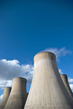 Cooling Towers of a coal fired power station against blue skyの写真素材