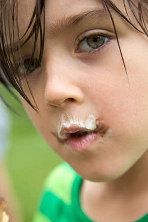 Portrait of young boy with ice cream round の写真素材