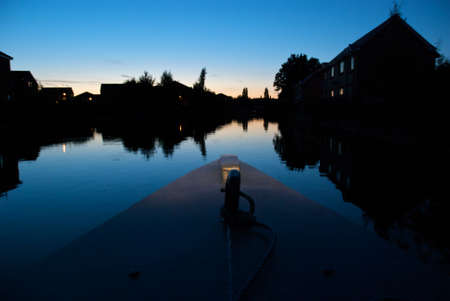 Traveling along a canal at twilightの写真素材