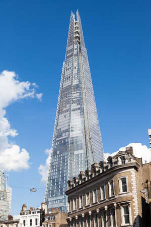 The Shard rises high above street level at London Bridge.のeditorial素材