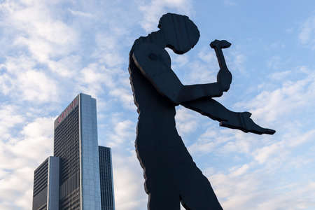 The sculpture, Hammering Man, by Jonathan Borofsky near Frankfurt Messe exhibition area is a mechanical construction with periodicaly moving arm holding hammer.の写真素材