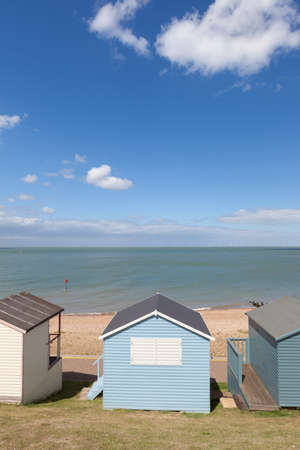 Wooden beach huts in a vertical composition with copy spaceの写真素材