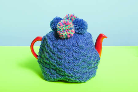 Teapot with knitted cosyの写真素材