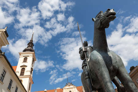 Brno, South Moravia, Czech Republic. Spire of Church of St Thomas (sv Tomas) with sculpture of a horse and knightの写真素材
