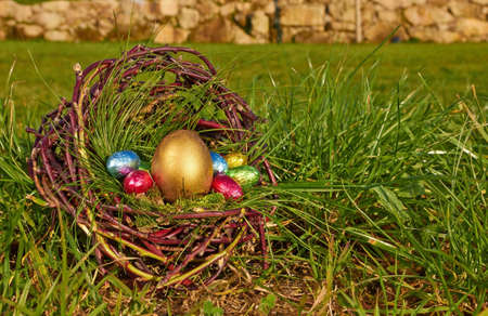 easter eggs in brown basket の写真素材