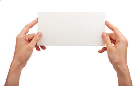 Business card in female hands. Studio isolatedの写真素材