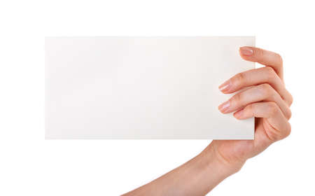 Woman holding blank business card in hand isolated on whiteの写真素材