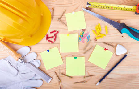 Different tools yellow forms on a wooden backgroundの写真素材