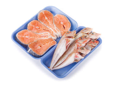 Raw fish in plastic packaging isolated on white backgroundの写真素材