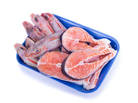 Raw fish in plastic packaging isolated on white backgroundの写真素材