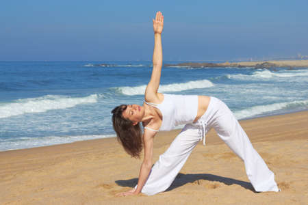 Yoga on the beach in summer dayの写真素材