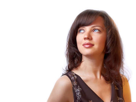 Blue-eyed smiling young woman looking upの写真素材