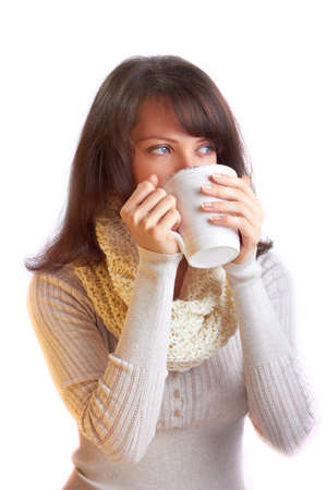 Young woman drinking hot teaの写真素材