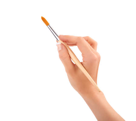 Hand with a brush isolatedの写真素材