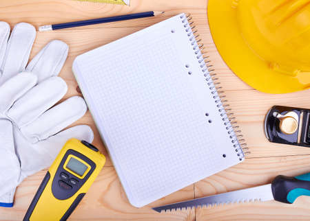 Different tools on a wooden background. 