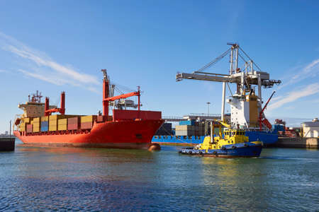 Industrial ship at sea towed by tug, Porto, Portugal