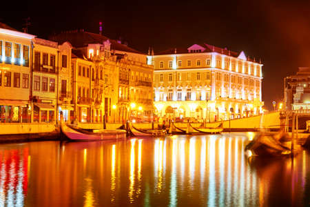 Vouga river with traditional boats, Aveiro at nightのeditorial素材