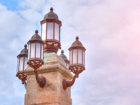 Vintage street lamp on the sky backgroundの写真素材