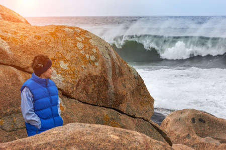 Mature Woman On storm Beachの写真素材