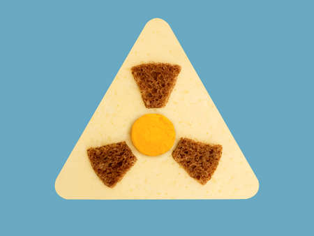 Radioactive ionizing radiation danger symbol with yellow and black stripes made from food, unsafe foodの写真素材