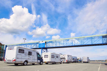DENMARK, HIRTSHALS- JUNE 05, 2013: White Tourist buses traffic jamのeditorial素材