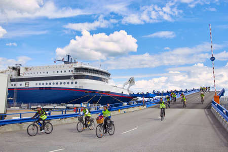 DENMARK, HIRTSHALS- JUNE 05, 2013: Cyclists disembarkation from ferryのeditorial素材