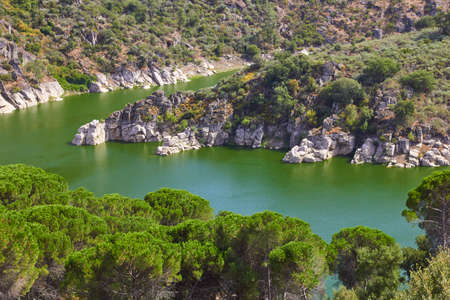 River rocky banks view. Portugalの写真素材