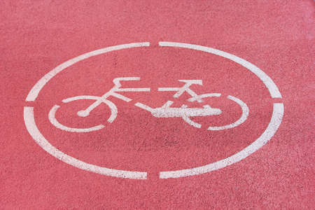 White bicycle sign on red bike path. Close-upの写真素材