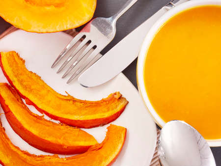 Slices of roast pumpkin and pumpkin soupの写真素材