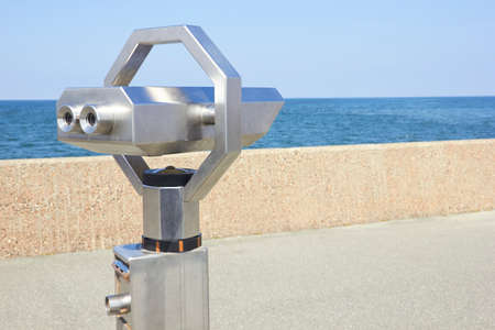 Tourist telescope at embankment