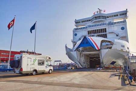 DENMARK, HIRTSHALS- JUNE 05, 2013: Tourist bus rides into the ferry.のeditorial素材