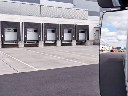 Loading and unloading ramps at large distribution and logistic warehouse. View inside the carの写真素材